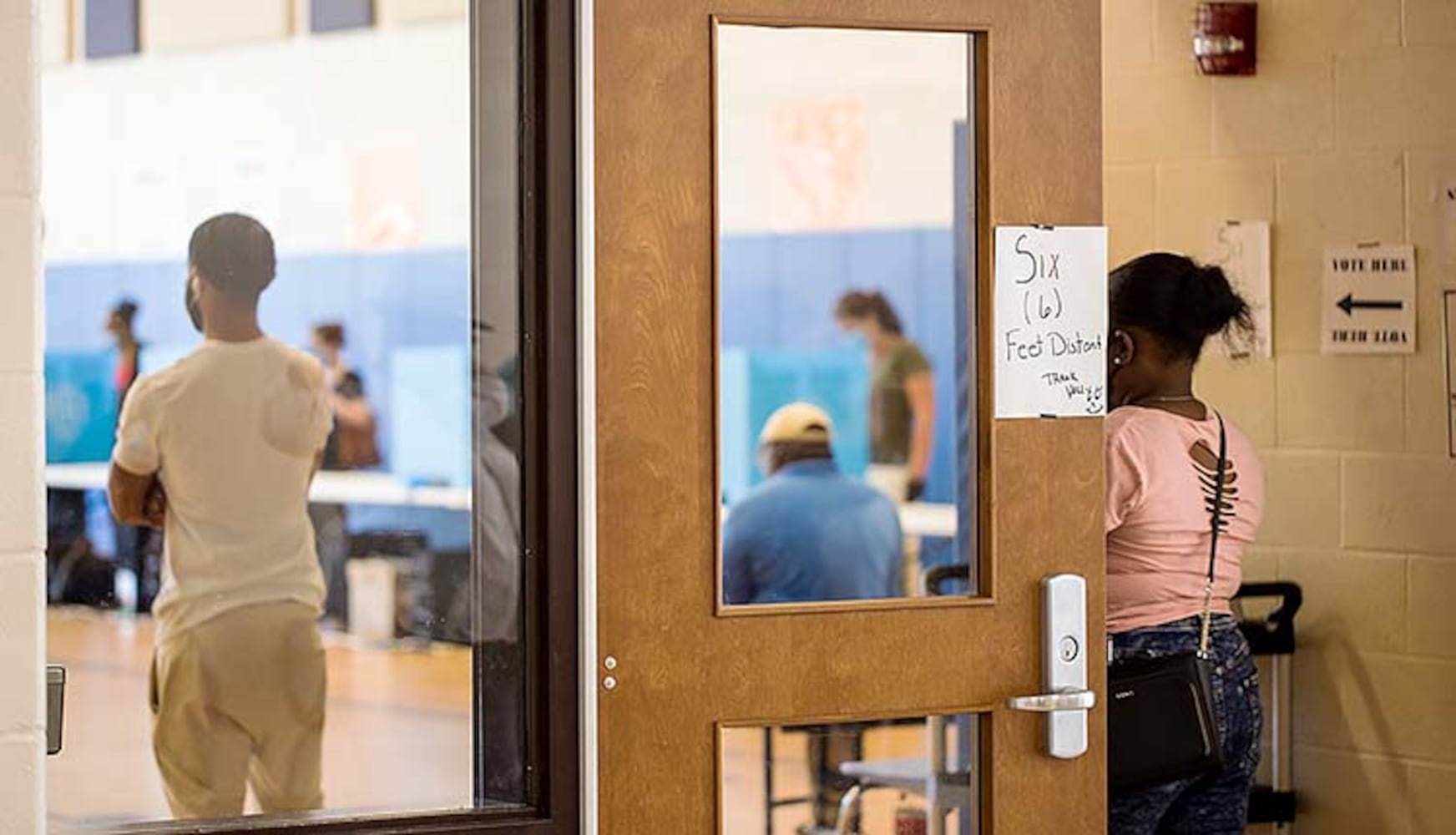 PHOTOS: Georgia voters struggle with long lines, new equipment, social distancing