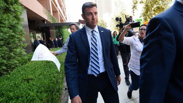 U.S. Rep. Duncan Hunter leaves an arraignment hearing Thursday, Aug. 23, 2018, in San Diego. Hunter and his wife Margaret pleaded not guilty Thursday to charges they illegally used his campaign account for personal expenses.