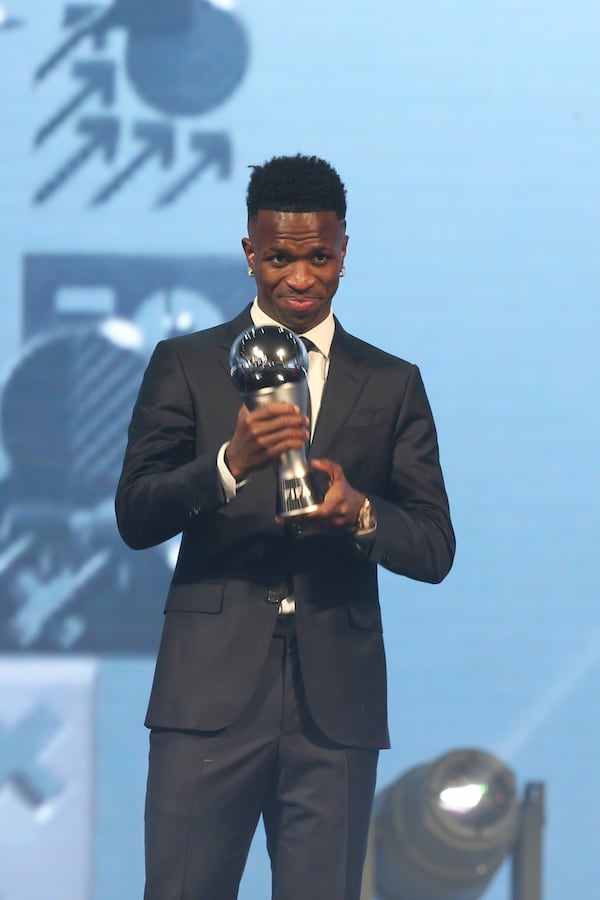 Vinicius Junior of Real Madrid is awarded as the Best Men's FIFA Player during the FIFA Football Awards 2024 in Doha, Qatar, Tuesday, Dec. 17, 2024. (AP Photo/Hussein Sayed)