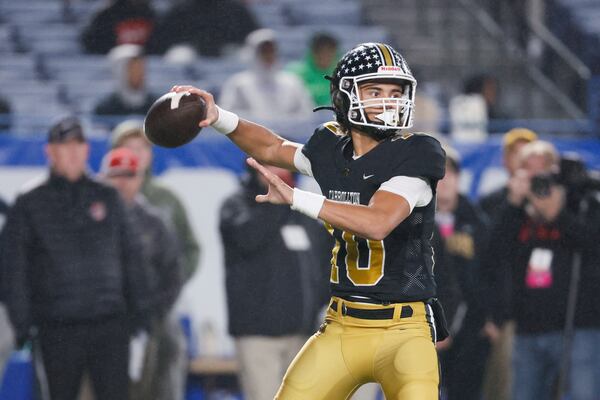 Carrollton quarterback Julian Lewis (10) attempts a pass during the first half against Mill Creek in the GHSA Class 7A finals, at Center Parc Stadium, Saturday, December 10, 2022, in Atlanta. Mill Creek defeated Carrollton 70-35. Carrollton freshman quarterback Julian Lewis threw for a state championship game record 531 yards and five touchdowns. (Jason Getz / Jason.Getz@ajc.com)