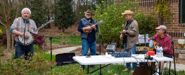 The Druid Hills Billys, Paul Parker (from left), Jim Culliton, Dave Cooper and Skip Romaner, perform at Clairmont Place in Decatur. The band, made up of physicians in the area, which regularly played at Clairmont Place before the pandemic, kept it up and increased performances during the lockdown. They played outdoors with residents listening from their balconies. PHIL SKINNER FOR THE ATLANTA JOURNAL-CONSTITUTION.