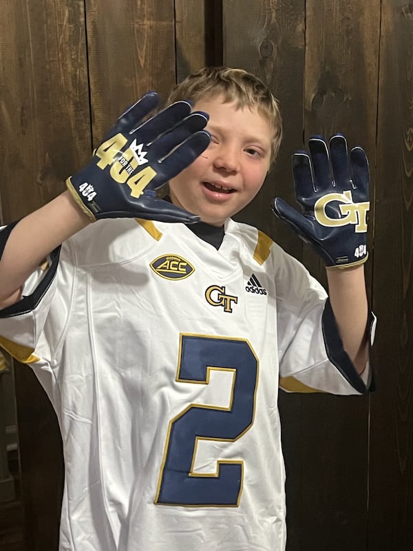 Brentley Russell wears a Georgia Tech No. 2 football jersey, the number worn by his friend Dylan Leonard, a Yellow Jackets tight end who met Brentley at Children's Scottish Rite Hospital in Atlanta. (Photo courtesy of Ashley Chastain).