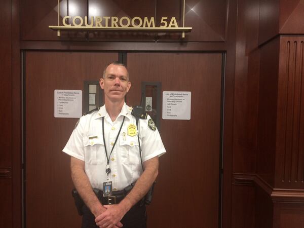 Atlanta police Maj. Rick Mason stands outside city court, where he pushed to close down a rooming house that has up to 19 residents. BILL TORPY / BTORPY@AJC.COM