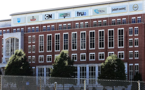 Turner Broadcasting, headquartered in Atlanta, is part of the $85 billion acquisition that was ruled on Tuesday.