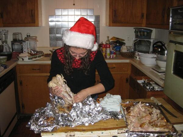 Olivia King strips the turkey on Thanksgiving morning, 2011, when her family gathered at her grandparents’ former home in Athens. CONTRIBUTED BY BILL KING