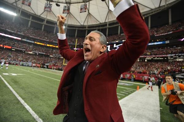 The sideline-stalking owner in a happier moment. (Brant Sanderlin/AJC photo)