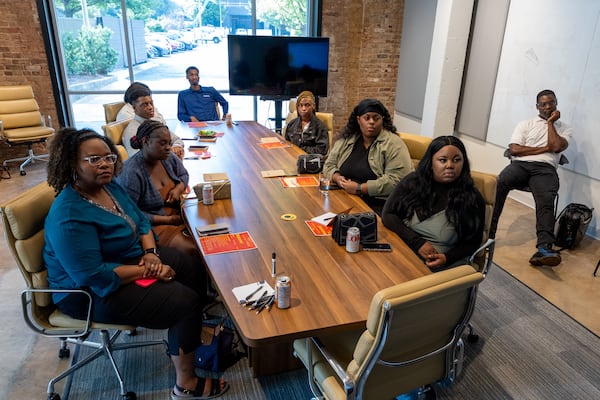 Staff and former foster youth with The nsoro Foundation attend an introduction to a solar apprenticeship class at Cherry Street Energy’s office in Atlanta on Friday, Aug. 16, 2024. (Arvin Temkar/AJC)