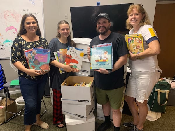 These HOPE volunteers are boxing up 700 Spanish books that will eventually go to Bolivia for the "B-Olivia" Library in La Paz, Bolivia. Noelle and Kevin Broyles helped to start the library, which shares books with marginalized populations throughout the country. Photo courtesy of North River HOPE Worldwide