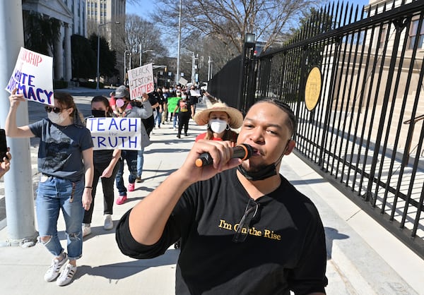 Teacher Anthony Downer leads educators during a rally outside the Georgia State Capitol on Feb. 12, 2022 .Educators, parents and activities rallied to protest legislation proposed by state GOP lawmakers that would limit what teachers may teach on race. (Hyosub Shin / Hyosub.Shin@ajc.com). (Hyosub Shin / Hyosub.Shin@ajc.com)