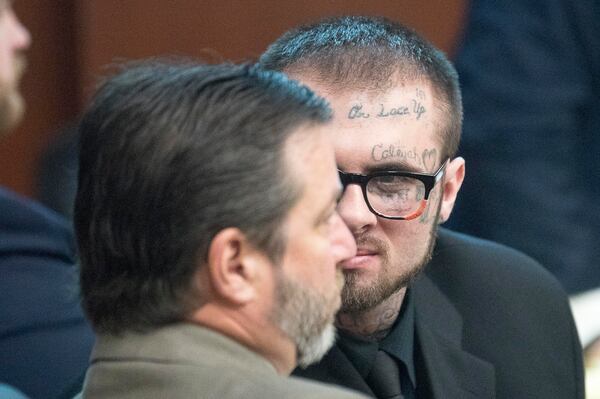 Christopher McNabb (center) speaks with his lawyer during the May 2019 trial.