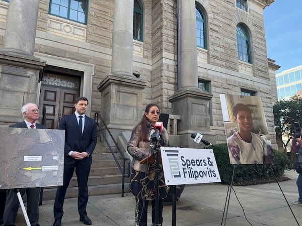 Belkis Terán, whose son was shot and killed by state troopers while protesting the construction of an Atlanta police training center, speaks at the DeKalb County Courthouse in Decatur, Ga., Tuesday, Dec. 17, 2024. (AP Photo/Charlotte Kramon)