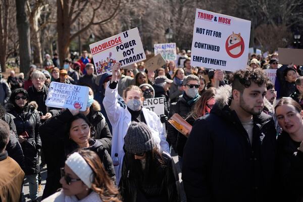 People participate in a "Stand Up for Science" rally in New York, Friday, March 7, 2025. (AP Photo/Seth Wenig)