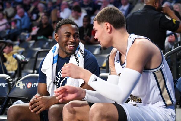 Georgia Tech walk-on guard Malachi Rice (left) speaks with teammate Jordan Usher during Tech's game against Clemson, February 25, 2020, McCamish Pavilion, Atlanta, Ga (Anthony McClellan/Georgia Tech Athletics)