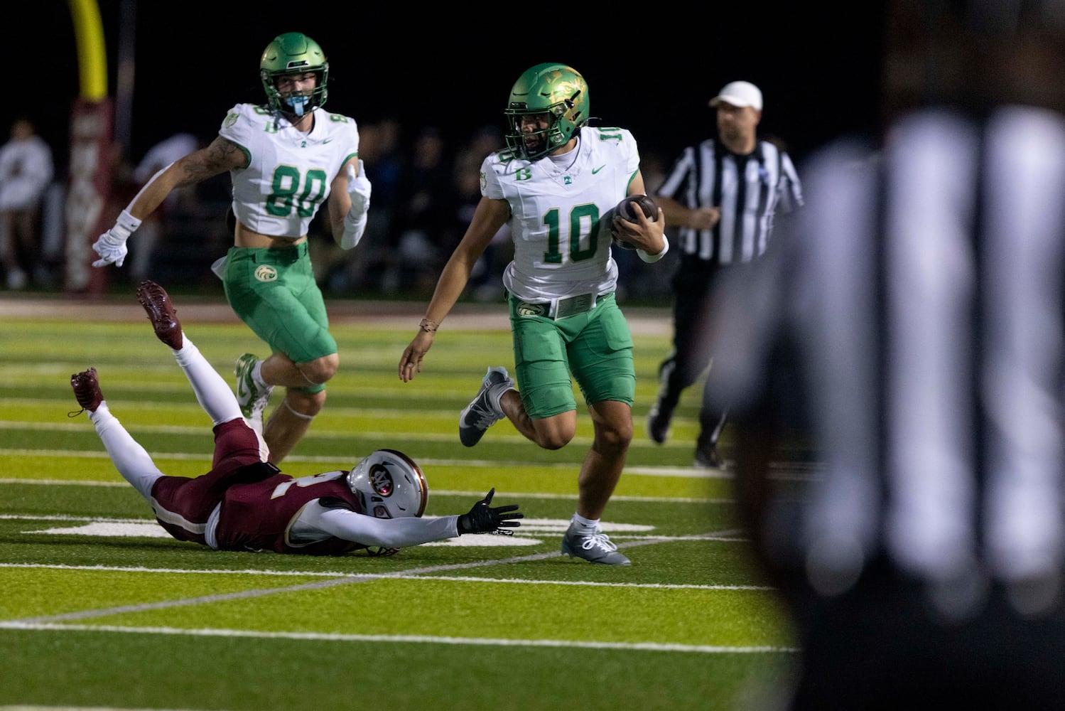 Buford’s Dayton Raiola (10) runs the ball. (Photo/Jenn Finch, AJC)