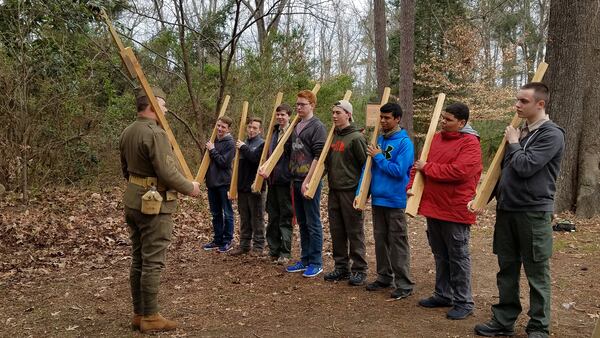 Teenage &quot;recruits&quot; learn a basic drill from a WW1 re-enactor. (Samantha Feuss/TNS)