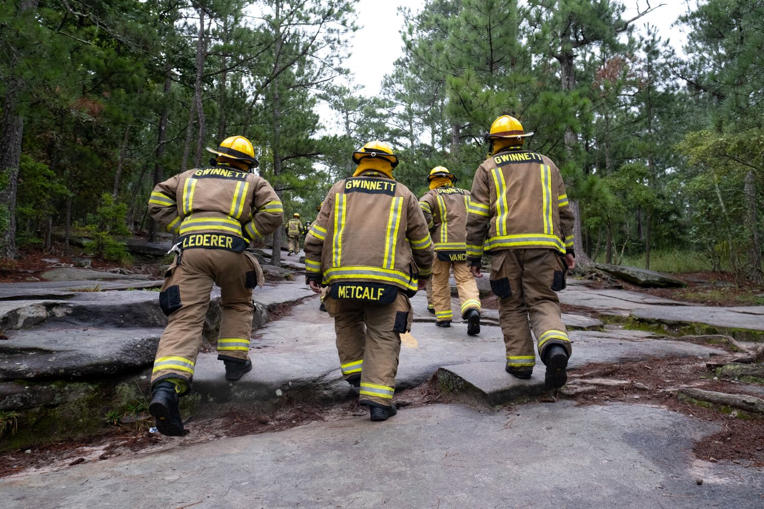 Firefighters climb Stone Mountain on Sunday morning, Sept. 11, 2022, during the annual remembrance of the 9/11 terrorist attacks. (Photo: Ben Gray for The Atlanta Journal-Constitution)