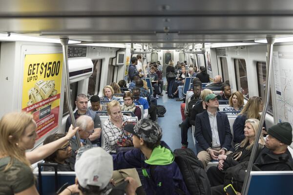 Passengers ride the Red Line train at the North Springs MARTA Station on Friday, March 31. Since the I-85 bridge fire Thursday, there will be plenty of new MARTA riders, as commuters try to find new ways to get to work and elsewhere. DAVID BARNES / DAVID.BARNES@AJC.COM