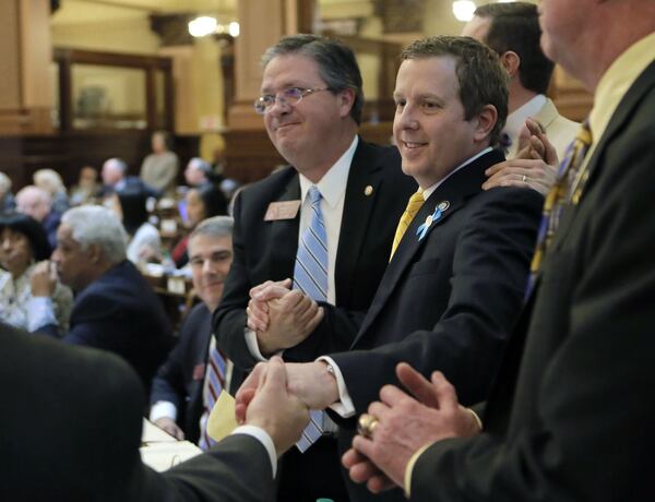 State Rep. Bert Reeves, R-Marietta, receives congratulations after the state House passed his adoption bill, House Bill 159. The House voted 168-0 on Thursday on a compromise over a major overhaul to make adoptions easier in the state. The state Senate, however, reconvened Thursday but took no action on the bill. BOB ANDRES /BANDRES@AJC.COM