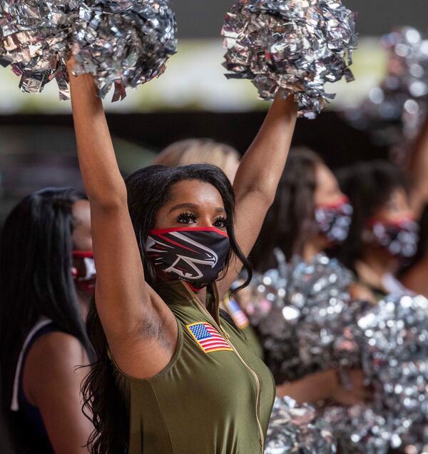 Atlanta Falcons cheerleaders perform in U.S. uniformed service like-outfits during the game at Mercedes-Benz Stadium in Atlanta, Sunday, November 8, 2020.  (Alyssa Pointer / Alyssa.Pointer@ajc.com)