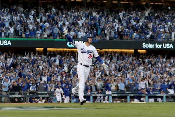 Los Angeles Dodgers first baseman Cody Bellinger reacts after hitting a three-run home run off of Atlanta Braves relief pitcher Luke Jackson.  Curtis Compton / curtis.compton@ajc.com 