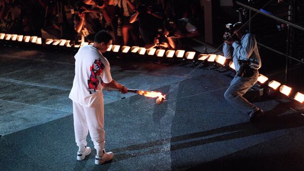 Muhammad Ali lights the wick that would ignite the Olympic Caldron during the Opening Ceremonies for the 1996 Summer Olympic Games July 19, 1996, at the Olympic Stadium in Atlanta. 