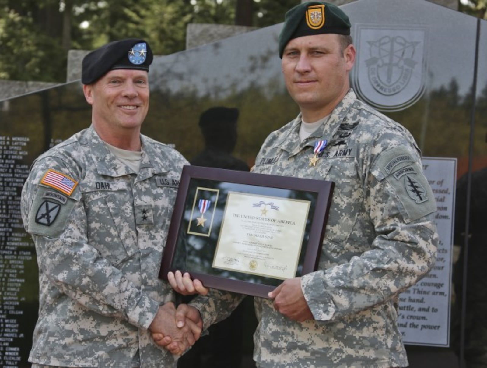 Earl Plumlee, right, now a master sergeant, is among three soldiers expected to receive the Medal of Honor next week.