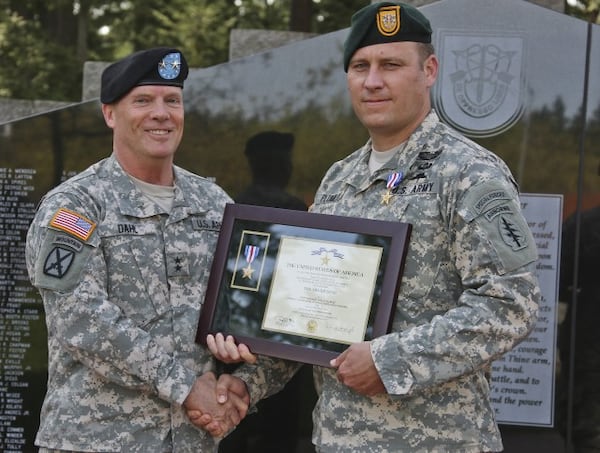 Earl Plumlee, right, now a master sergeant, is among three soldiers expected to receive the Medal of Honor next week.