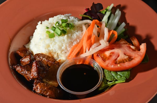 A beef bowl with rice and veggies is a hearty option from O Mi Ga at Municipal Market. Chris Hunt for The Atlanta Journal-Constitution