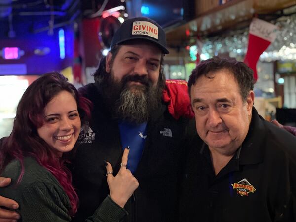 Farran Waterhouse (from left) and Travis Herman from Scofflaw Brewing Co. are seen with Andy Klubock at the annual Georgia Beer Dinner in December 2021. Courtesy of Mary Fiorello 