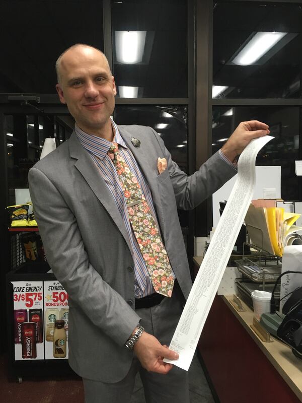 Georgia Tech strength and conditioning coach Dan Taylor shows off the receipt from the men's basketball team's visit to a gas station in Winston-Salem, N.C., after beating Wake Forest Feb. 19, 2020. (Ken Sugiura/AJC)