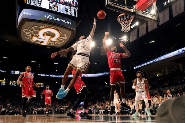 Georgia Tech Yellow Jackets guard Deivon Smith (5) attempts a shot against Northern Illinois Huskies forward Harvin Ibarguen (23) during the first half in a NCAA men’s basketball game at McCamish Pavilion, Thursday, November 17, 2022, in Atlanta. Jason Getz / Jason.Getz@ajc.com)