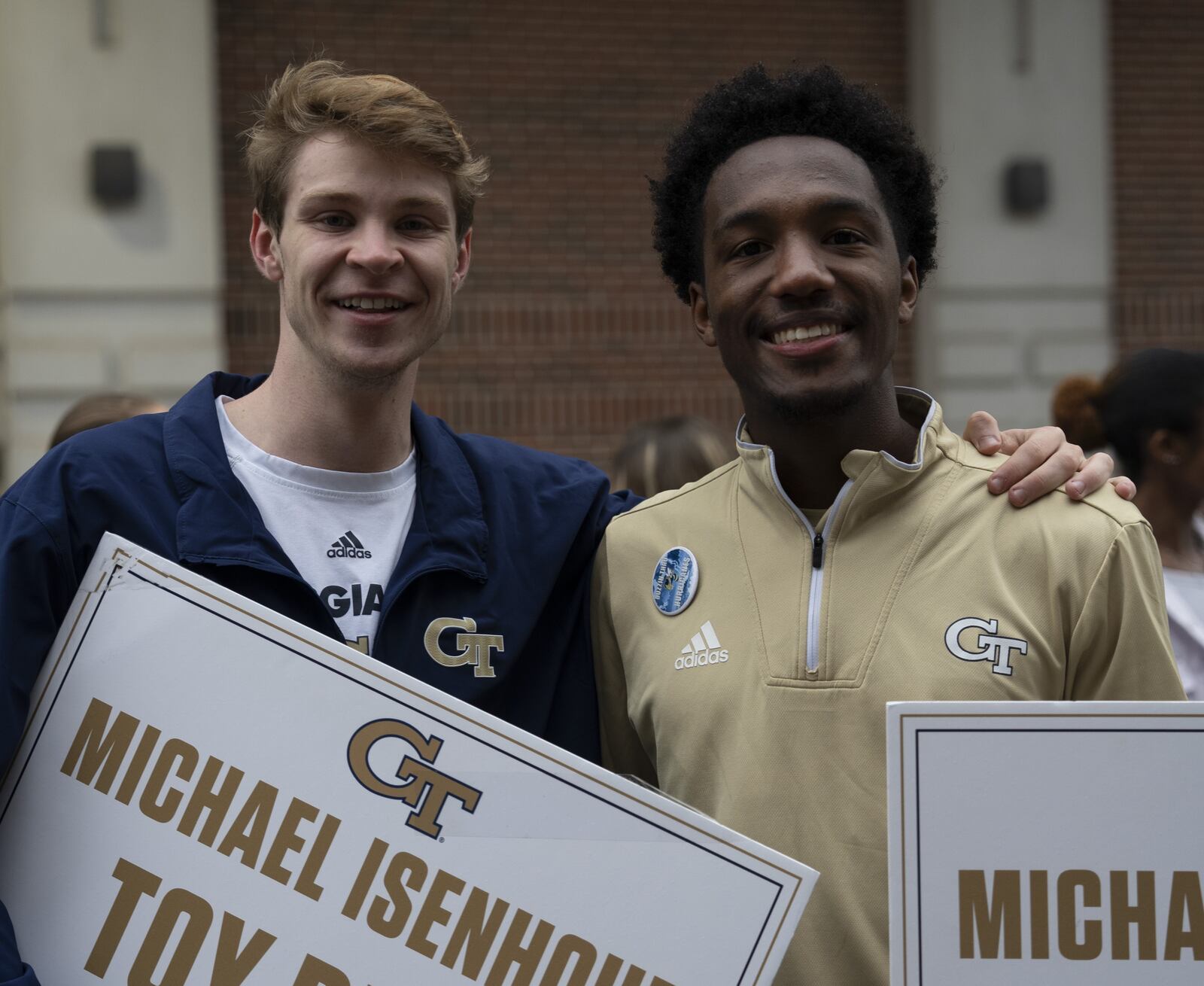 Georgia Tech cross country team members  Jack Voss and Myles Collins during the 22nd annual Michael Isenhour Toy Drive outside Bobby Dodd Stadium in November 2022. The drive is held by Georgia Tech student athletes during the last home football game of the season.