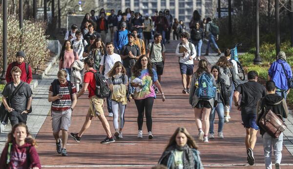 Georgia Tech students were on the move in between classes on campus on Wednesday, March 11, 2020. Georgia Tech, like other state colleges and universities, closed campuses due to the coronavirus outbreak and is offering online counseling services for students needing assistance. JOHN SPINK / JSPINK@AJC.COM