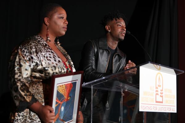 Patrisse Cullors (left), co-founder of Black Lives Matter, presents 21 Savage with an award at the NILC Courageous Luminaires Awards last week. (Photo by Jerritt Clark/Getty Images for NILC)