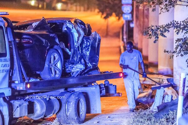 A car was removed from the scene of a fiery crash at Cheshire Bridge Road and I-85. JOHN SPINK / JSPINK@AJC.COM