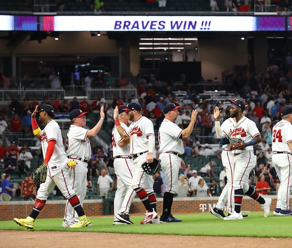 Braves outfielder Michael Harris (far right) and teammates celebrate a 3-2 victory over the New York Mets to win the series in a MLB baseball game on Thursday, August 18, 2022, in Atlanta.   “Curtis Compton / Curtis Compton@ajc.com