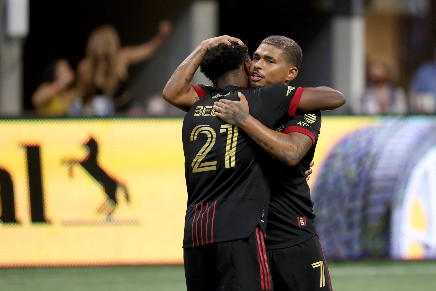 Atlanta United defender George Bello (21) celebrates his goal with forward Josef Martinez during the second half against D.C. United at Mercedes Benz Stadium Saturday, September 18, 2021 in Atlanta, Ga.. JASON GETZ FOR THE ATLANTA JOURNAL-CONSTITUTION