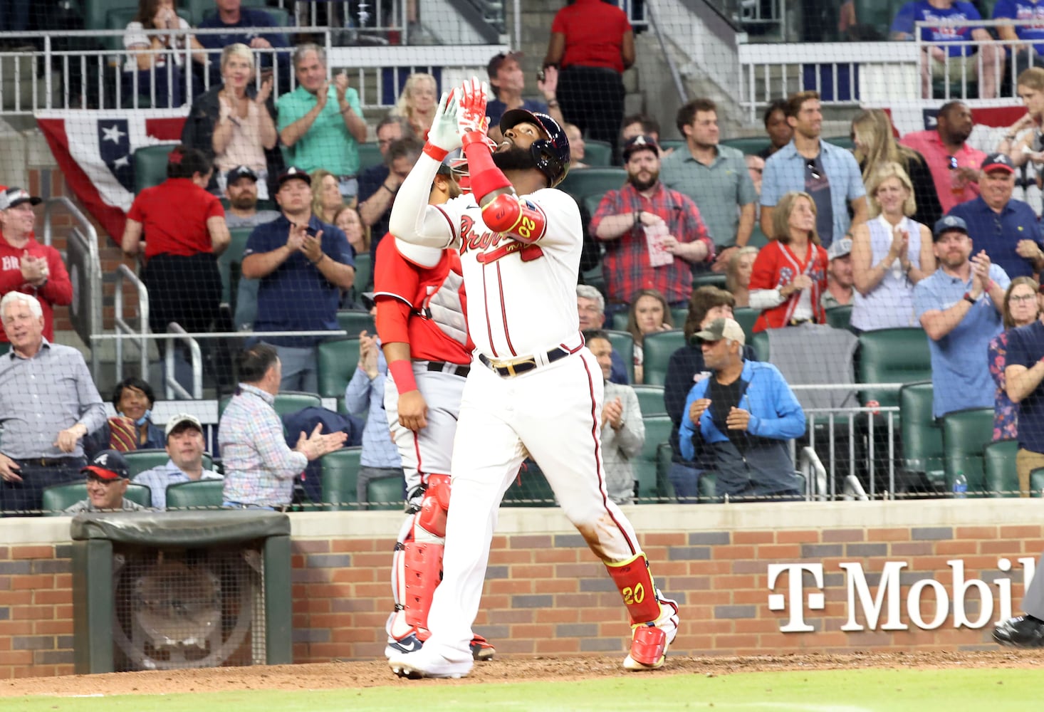 Atlanta Braves left fielder Marcell Ozuna (20) looks up to the sky as he crosses the home plate after hitting a  solo home run in the 4th inning at Truist Park. Tuesday, April 12, 2022. Miguel Martinez/miguel.martinezjimenez@ajc.com