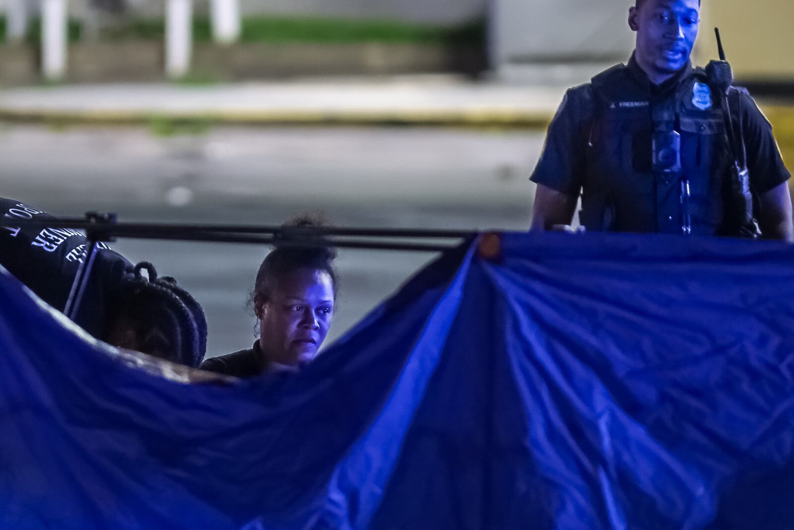 Crime scene investigators document evidence after a deadly shooting at a Chevron gas station in Buckhead early Thursday morning.