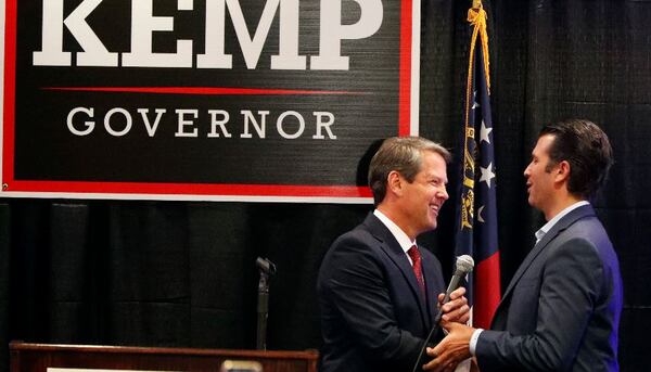 Republican gubernatorial nominee Brian Kemp, left, welcomes Donald Trump Jr on stage during a campaign event Tuesday in Athens. AP/John Bazemore