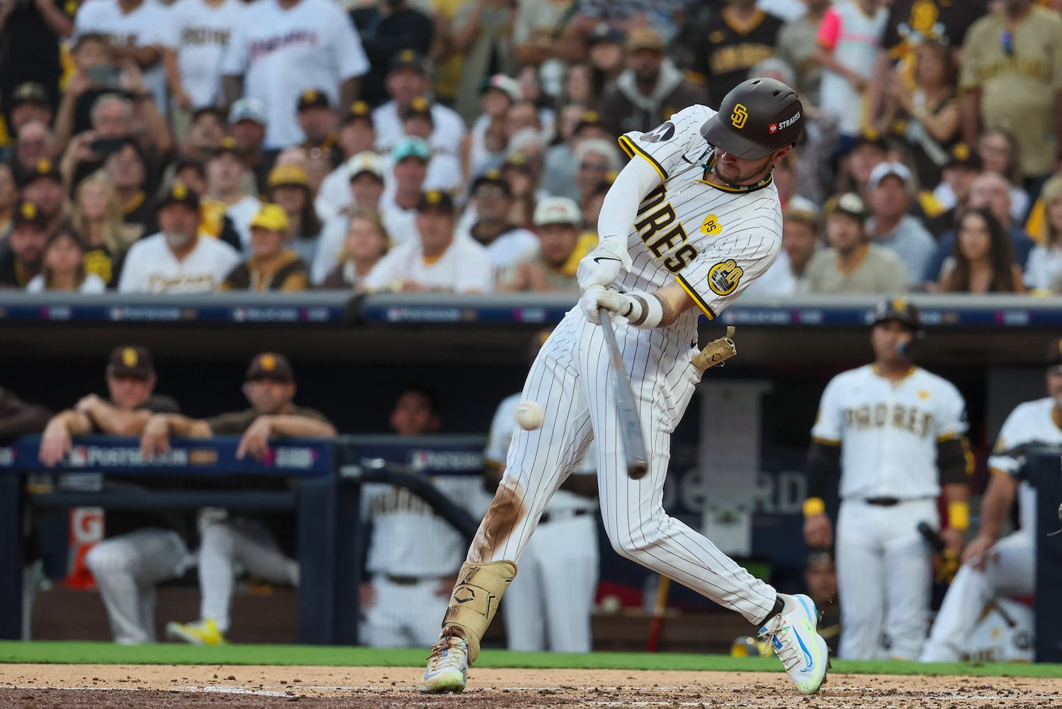 San Diego Padres outfielder Jackson Merrill triples against the Atlanta Braves to score two runs during the second inning of National League Division Series Wild Card Game Two at Petco Park in San Diego on Wednesday, Oct. 2, 2024.   (Jason Getz / Jason.Getz@ajc.com)