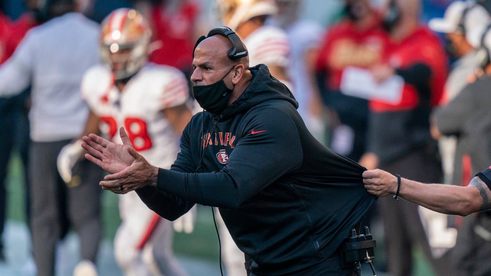 San Francisco 49ers defensive coordinator Robert Saleh cheers on his team from the sideline during the first half Nov. 1, 2020, against the Seahawks in Seattle. One year ago, Saleh and Kansas City Chiefs offensive coordinator Eric Bieniemy missed out on the coaching carousel despite being coordinators of the two Super Bowl teams. The two figure to be near the top of many of the lists of possible head coaching candidates again this offseason when the NFL is hoping some new rules lead to more opportunities for minority coaches. (Stephen Brashear/AP)