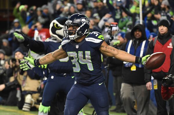  SEATTLE, WA - JANUARY 07: Thomas Rawls #34 of the Seattle Seahawks celebrates scoring a 4-yard touchdown during the fourth quarter against the Detroit Lions in the NFC Wild Card game at CenturyLink Field on January 7, 2017 in Seattle, Washington. (Photo by Steve Dykes/Getty Images)