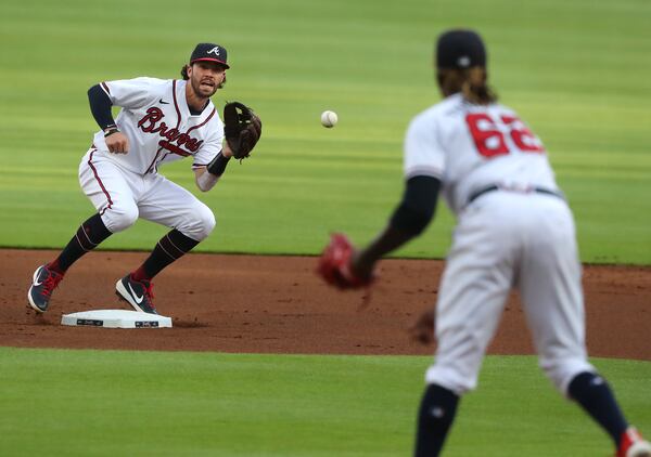 Braves pitcher Touki Toussaint throws to shortstop Dansby Swanson to pick off Nationals' Juan Soto as he attempts to steal second base during the first inning Monday, Aug.17, 2020 in Atlanta.  