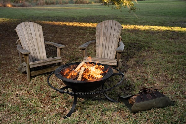 Cozy up around a fire pit for and keep warm with space to prop everyone’s feet.