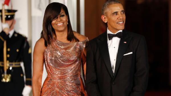 President Barack Obama and first lady Michelle Obama waits to greet Italian Prime Minister Matteo Renzi and his wife Agnese Landini on the North Portico for a State Dinner at the White House in Washington, Tuesday, Oct. 18, 2016. (AP Photo/Pablo Martinez Monsivais)