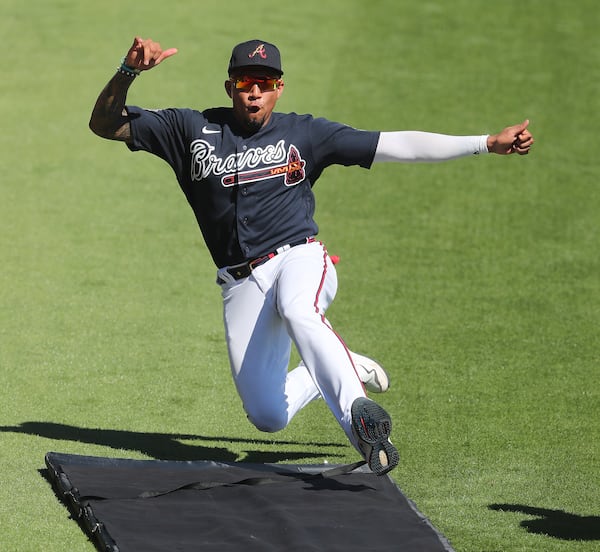 Braves infielder Johan Camargo shows his form hitting the sliding mat during team drills at spring training Friday, Feb. 26, 2021, at CoolToday Park in North Port, Fla. (Curtis Compton / Curtis.Compton@ajc.com)