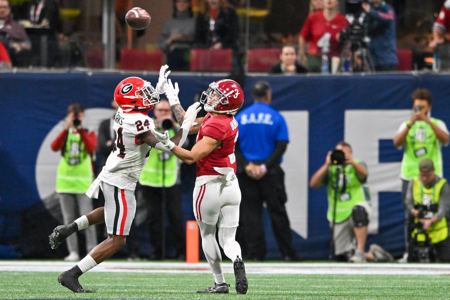 Georgia Bulldogs defensive back Malaki Starks (24) covers Alabama Crimson Tide wide receiver Jermaine Burton (3) on a pass interference call during the first half of the SEC Championship football game at the Mercedes-Benz Stadium in Atlanta, on Saturday, December 2, 2023. (Hyosub Shin / Hyosub.Shin@ajc.com)