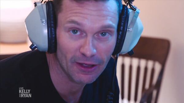  Ryan Seacrest wearing the headset he used when he was a kid pretending to be doing AT40 countdowns. Now he does it for real!