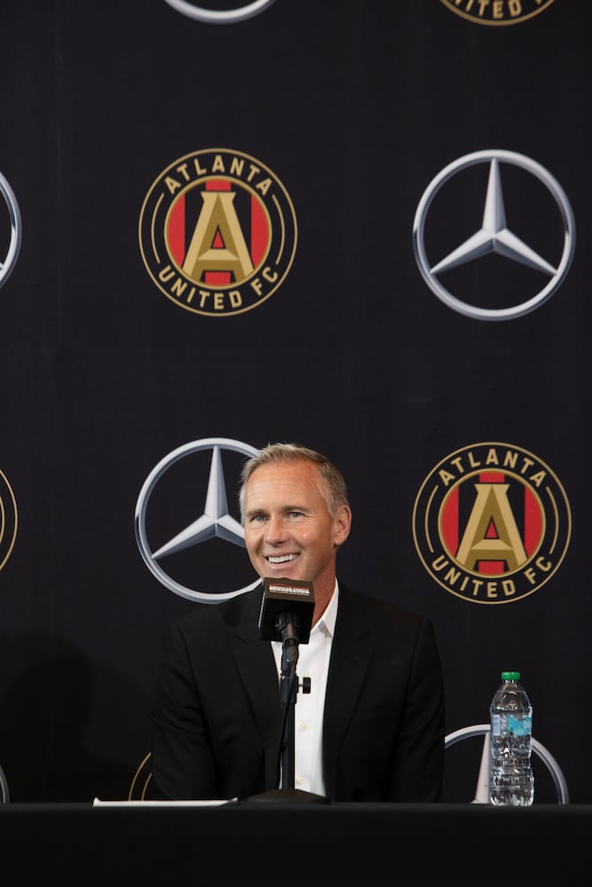 Chris Henderson (right), the newly appointed chief soccer officer and sporting director of Atlanta United, speaks during a press conference introducing Henderson as the new technical director on Tuesday, December 17, 2024, at the Atlanta United training grounds in Marietta, Georgia. CHRISTINA MATACOTTA FOR THE ATLANTA-JOURNAL CONSTITUTION.


